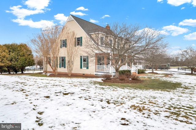 view of snowy exterior with a porch