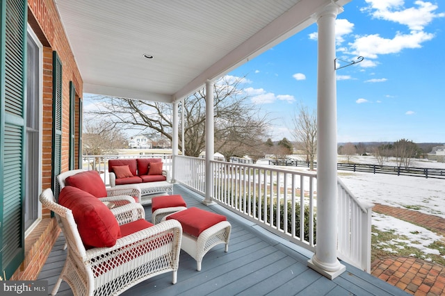 view of snow covered deck