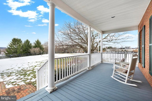 view of snow covered deck