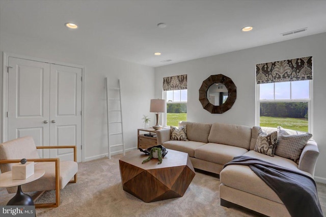 living room featuring light colored carpet