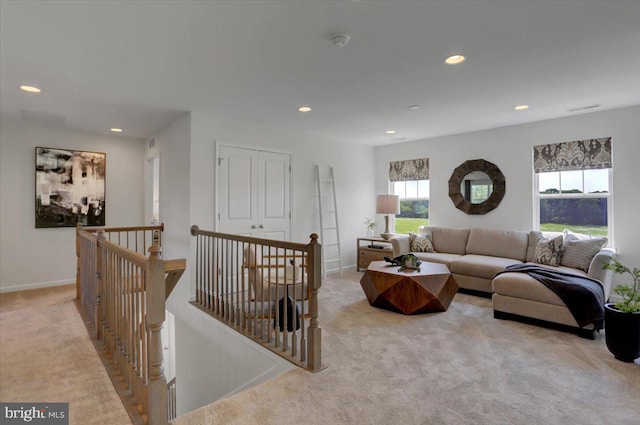 living room featuring light carpet