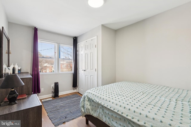 bedroom featuring a closet and hardwood / wood-style flooring