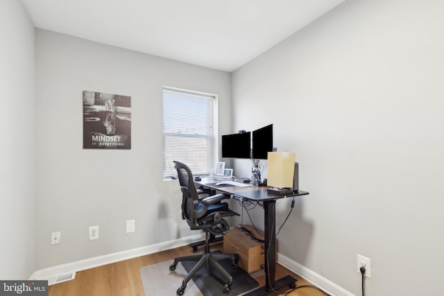 office area with hardwood / wood-style flooring