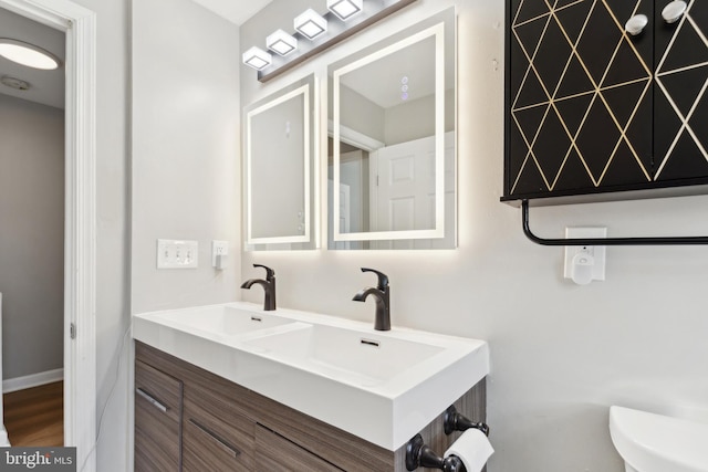 bathroom with vanity and toilet