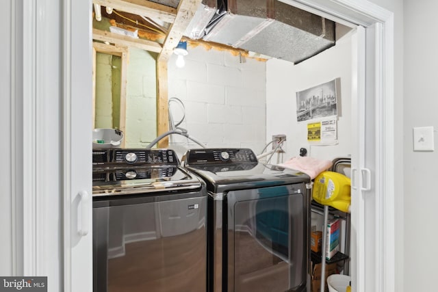 laundry room featuring separate washer and dryer