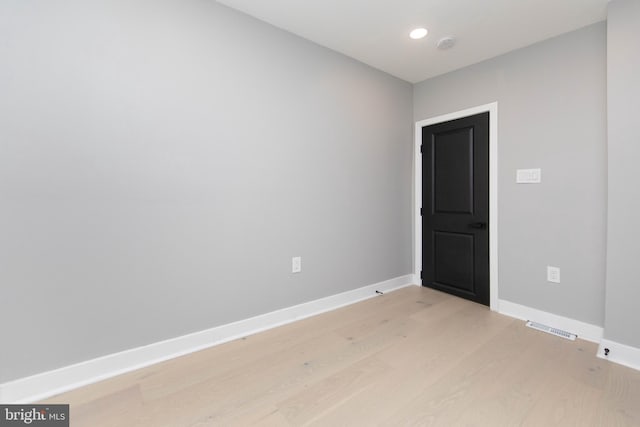 spare room with light hardwood / wood-style flooring