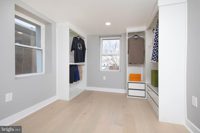 spacious closet featuring light hardwood / wood-style flooring