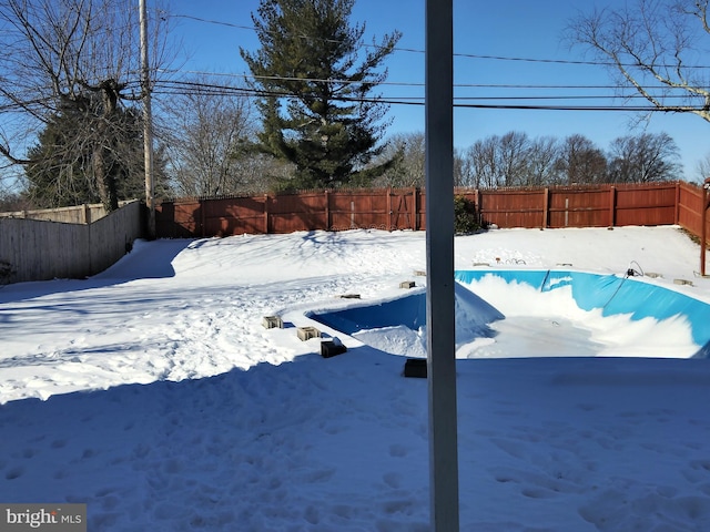 view of yard layered in snow