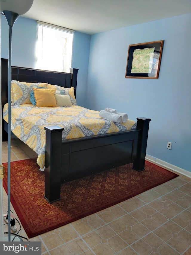 bedroom featuring light tile patterned floors