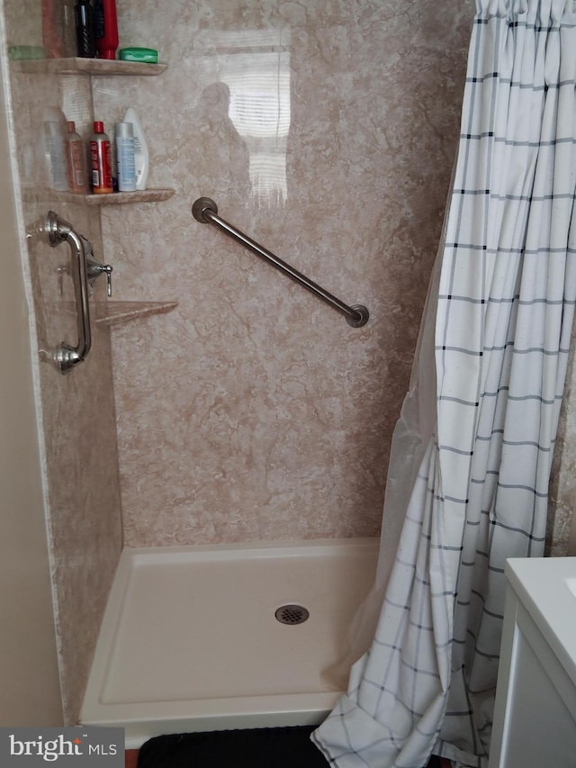 bathroom with a shower with shower curtain