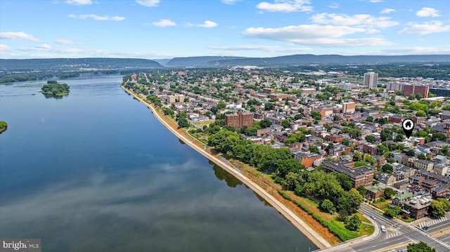 birds eye view of property featuring a water and mountain view