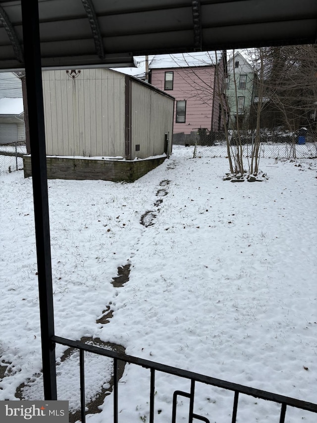 view of yard covered in snow