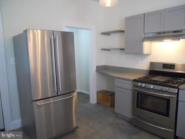 kitchen with gray cabinetry and appliances with stainless steel finishes