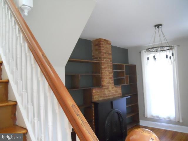 stairs with hardwood / wood-style floors