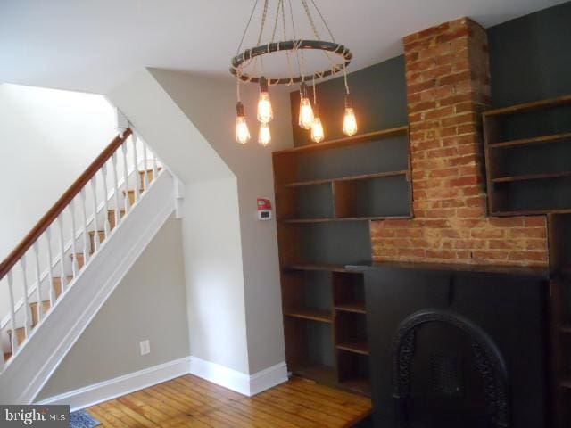 interior space featuring a chandelier and hardwood / wood-style floors