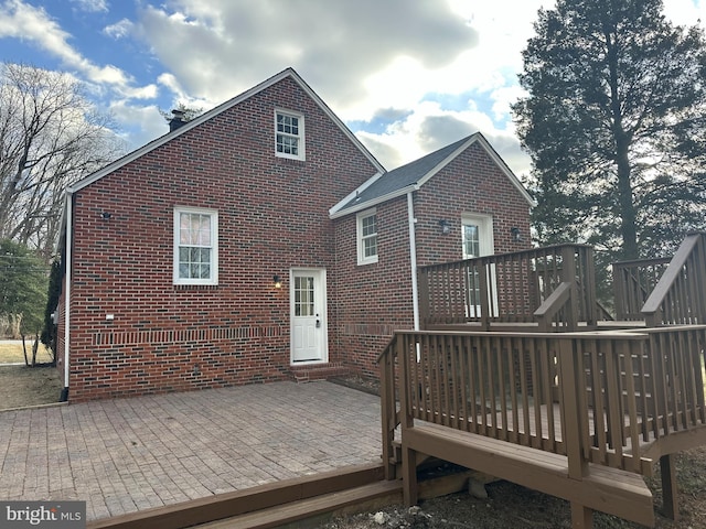 back of property with a patio and a deck