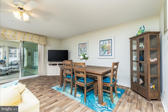 dining area featuring ornamental molding, hardwood / wood-style floors, and ceiling fan