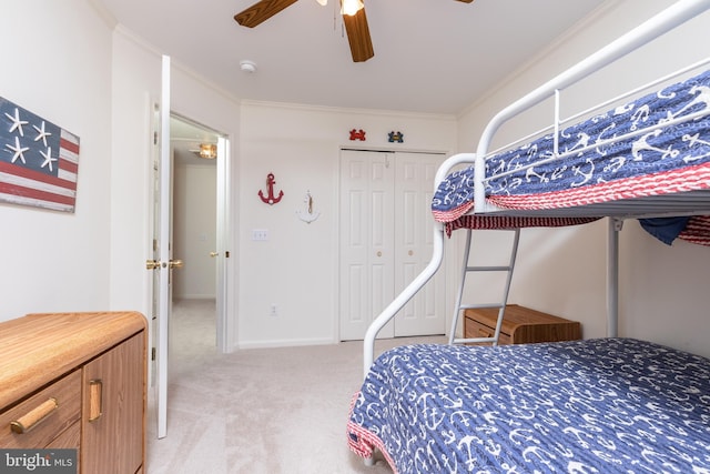 bedroom featuring ornamental molding, light colored carpet, and ceiling fan