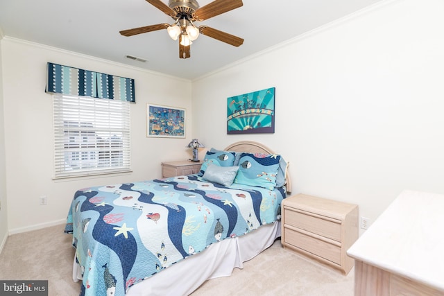 bedroom with crown molding, light carpet, and ceiling fan