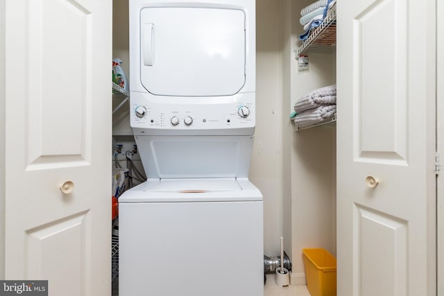 laundry area featuring stacked washer and clothes dryer