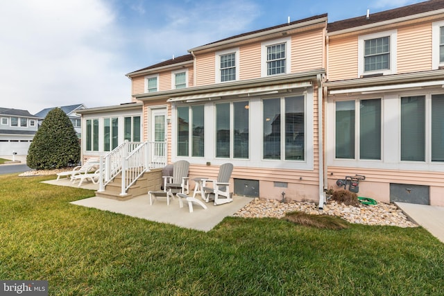 back of property featuring a patio and a yard