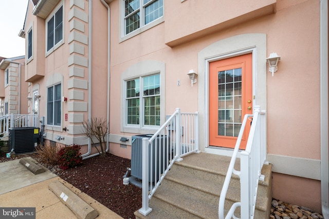 entrance to property featuring central AC unit