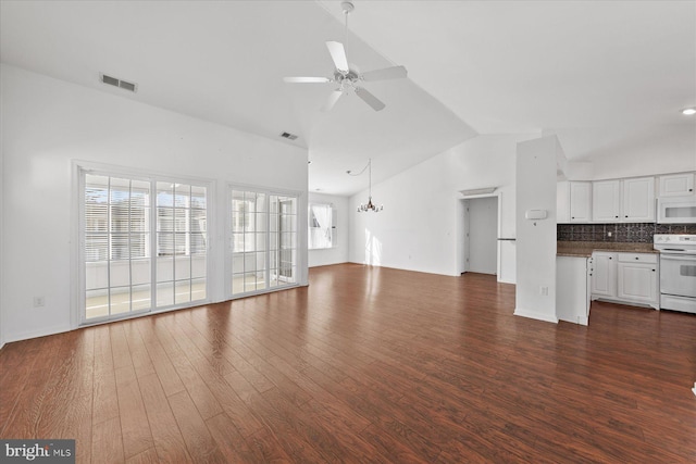 unfurnished living room featuring dark hardwood / wood-style flooring, ceiling fan with notable chandelier, and lofted ceiling