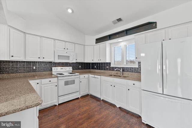 kitchen with stone counters, white cabinetry, sink, dark wood-type flooring, and white appliances