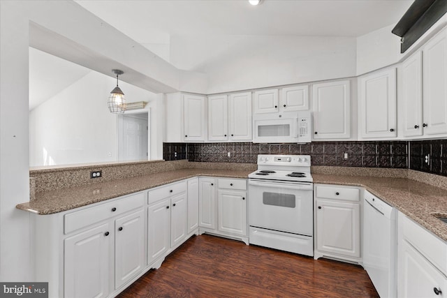 kitchen with tasteful backsplash, white appliances, pendant lighting, white cabinets, and lofted ceiling