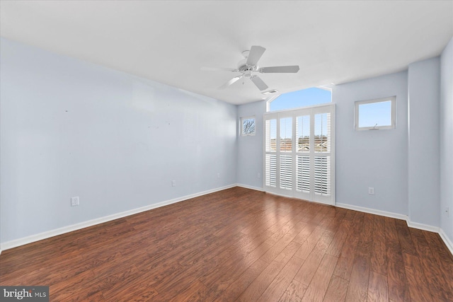 unfurnished room featuring ceiling fan and dark hardwood / wood-style flooring