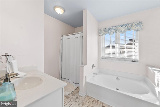 bathroom with vanity and a bathtub