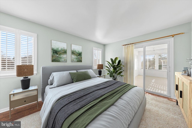 bedroom featuring access to outside and light hardwood / wood-style floors