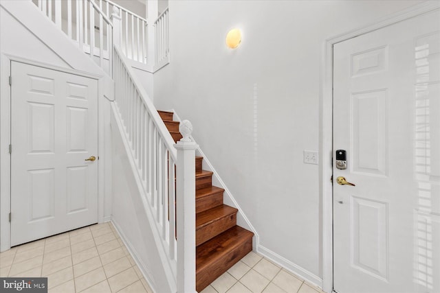 stairs with tile patterned floors