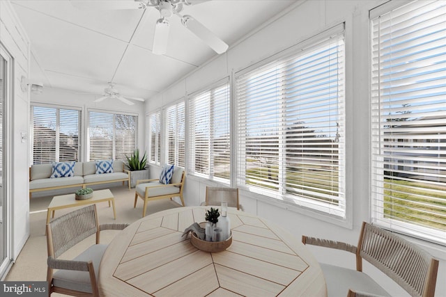 sunroom featuring ceiling fan