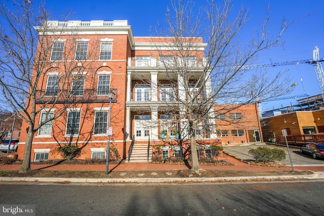 view of property with a balcony