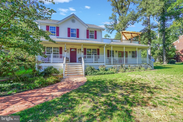 view of front of home with covered porch and a front yard