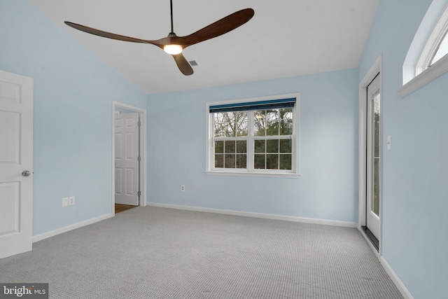 unfurnished bedroom with multiple windows, light colored carpet, ceiling fan, and lofted ceiling