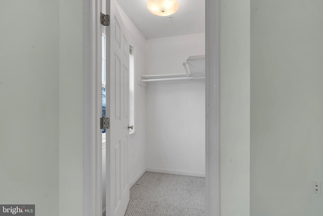 spacious closet featuring light tile patterned floors