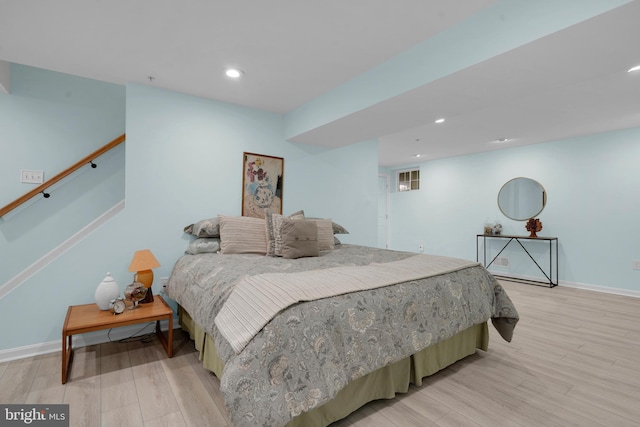 bedroom with light wood-type flooring