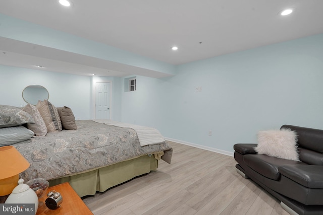 bedroom with light hardwood / wood-style floors