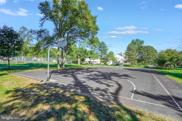 view of basketball court featuring a lawn