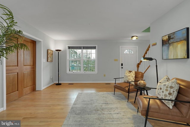 living area with light hardwood / wood-style flooring