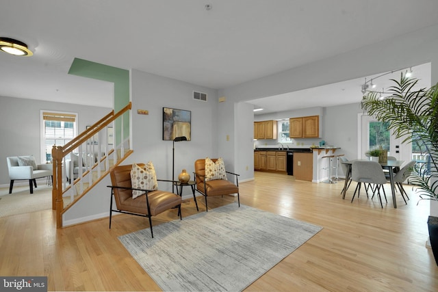 living room with light hardwood / wood-style floors