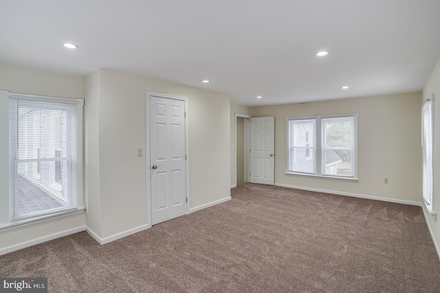 spare room featuring carpet floors