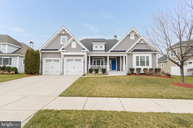 craftsman inspired home with a porch, a garage, and a front yard