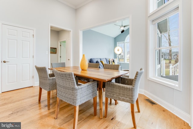 dining room with ceiling fan, light hardwood / wood-style floors, and ornamental molding