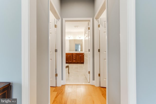 hall with light hardwood / wood-style floors