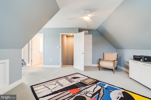 additional living space with ceiling fan, light colored carpet, and lofted ceiling