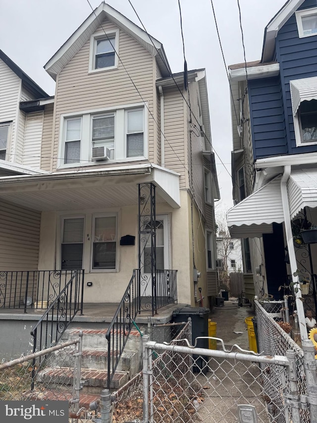 view of front of home featuring cooling unit and covered porch