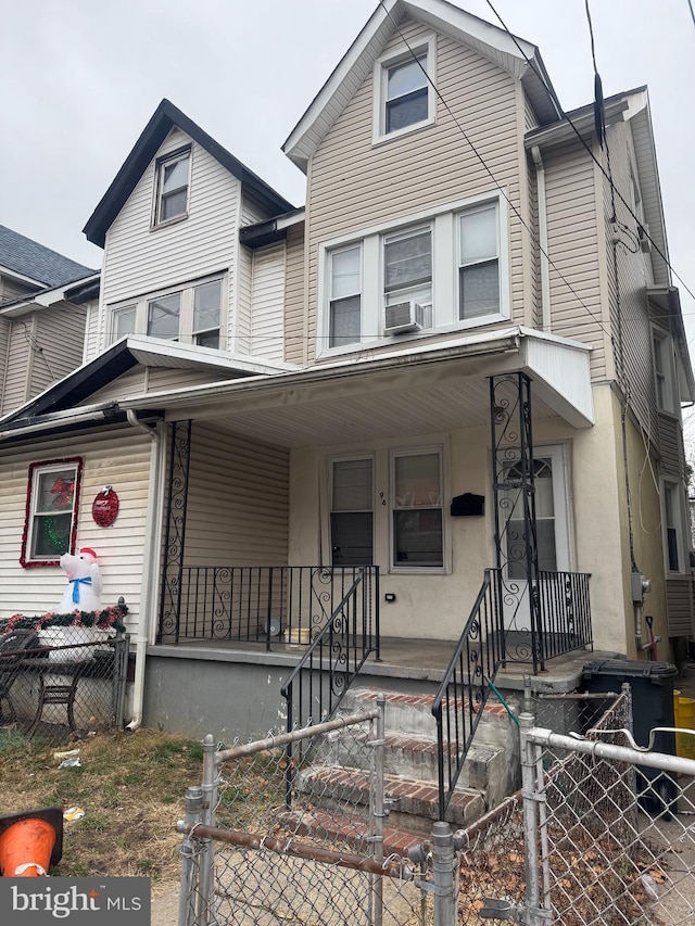 view of front of home with cooling unit and covered porch